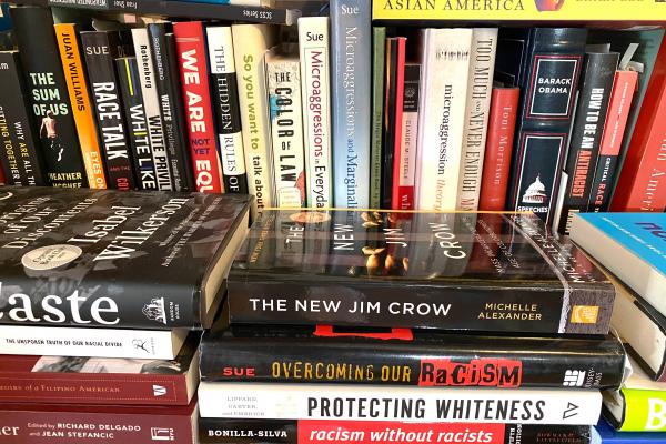 Assortment of diversity, anti-racism, and race-related books aligned mostly vertical 